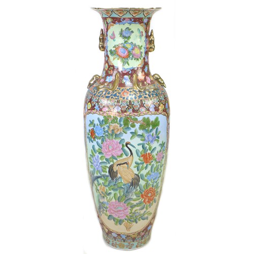 3 - A gargantuan 20th century Oriental style vase, of baluster form with gilt lug handles, its reserves ... 