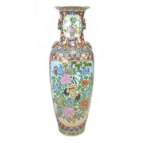 3 - A gargantuan 20th century Oriental style vase, of baluster form with gilt lug handles, its reserves ... 