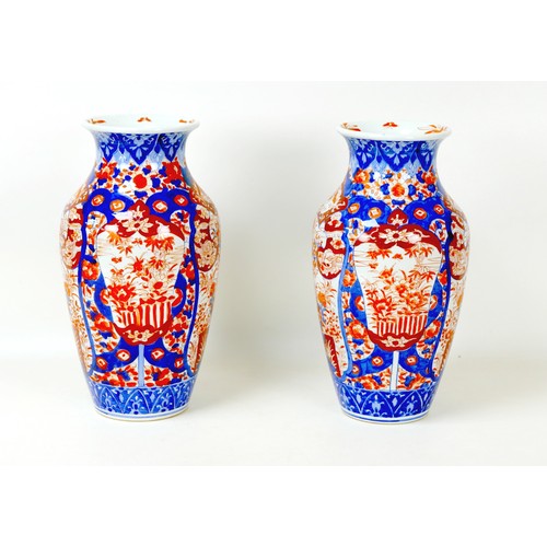 5 - Two Japanese porcelain vases, early 20th century, Imari pattern, one a/f, 20 by 39cm high, the other... 