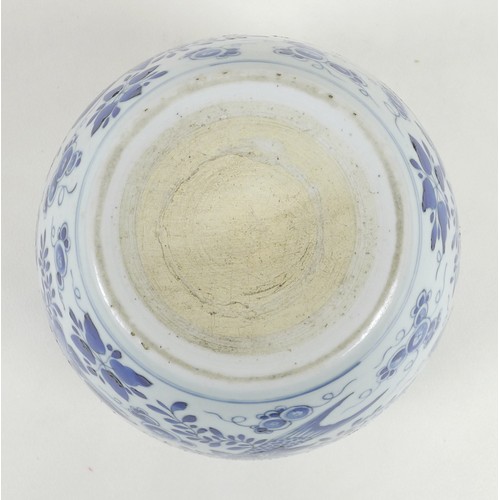 2 - A Chinese porcelain blue and white fish bowl, decorated with fish and foliate detail, 22.5 by 18cm h... 