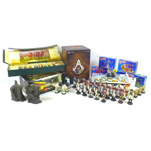 69 - A mixed collection of toys and figurines, comprising a large quantity of plastic soldier and animal ... 