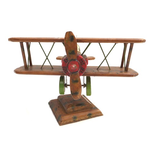 68 - A vintage wooden scratch built WWI biplane, possibly a Sopwith Camel, decorated with hand painted RA... 