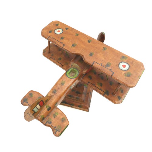 68 - A vintage wooden scratch built WWI biplane, possibly a Sopwith Camel, decorated with hand painted RA... 