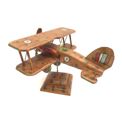 68 - A vintage wooden scratch built WWI biplane, possibly a Sopwith Camel, decorated with hand painted RA... 