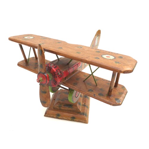 68 - A vintage wooden scratch built WWI biplane, possibly a Sopwith Camel, decorated with hand painted RA... 