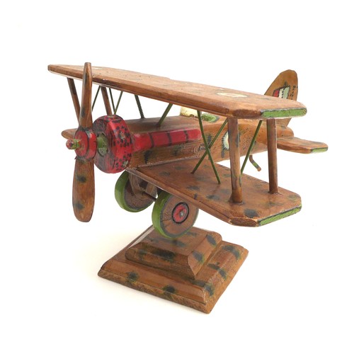 68 - A vintage wooden scratch built WWI biplane, possibly a Sopwith Camel, decorated with hand painted RA... 