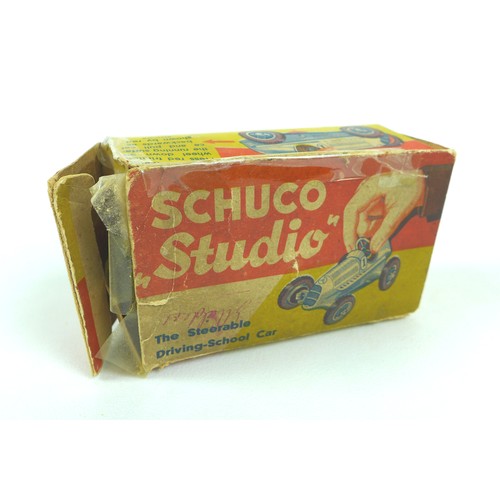 70 - A Schuco Studio tinplate clockwork model racing car, 'The Steerable Driving-School Car', blue, 'No 8... 