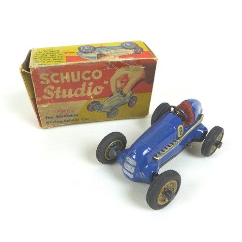 70 - A Schuco Studio tinplate clockwork model racing car, 'The Steerable Driving-School Car', blue, 'No 8... 