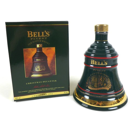 76 - A group of commemorative Bell's Whisky decanters, comprising a Christmas 1991 decanter, 70cl, 40% vo... 