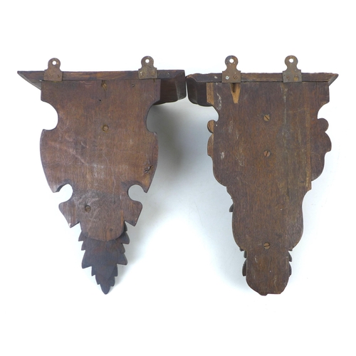 101 - Two late 19th century carved oak wall brackets, each with individual designs, one with a ram's head,... 