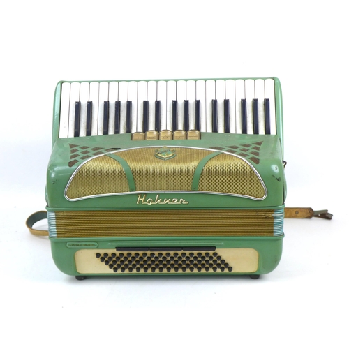 121 - A vintage Hohner piano accordion, Lucia II Musette, pale green, in working order.