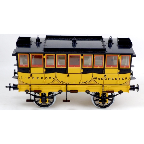 128 - A Hornby model of Stephenson's Rocket, together with G104 coach, both boxed, and a collection of loo... 