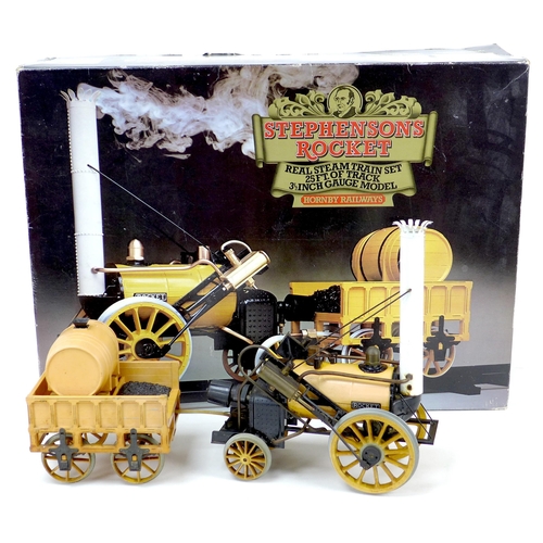 128 - A Hornby model of Stephenson's Rocket, together with G104 coach, both boxed, and a collection of loo... 