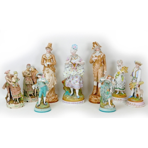 13 - A group of nine large 19th century style bisque figurines, depicting ladies and gentleman in 18th/19... 