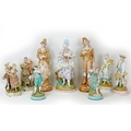 A group of nine large 19th century style bisque figurines, depicting ladies and gentleman in 18th/19... 