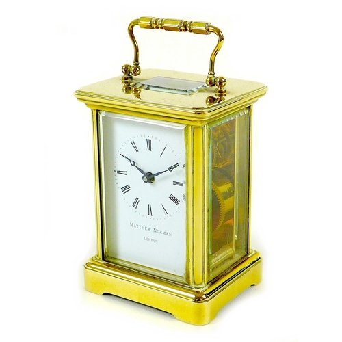 138 - A brass carriage clock by Matthew Norman, circa 1980s, the white dial with black Roman numerals and ... 