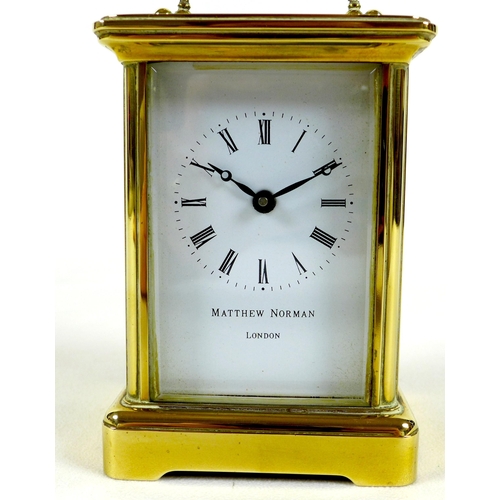 138 - A brass carriage clock by Matthew Norman, circa 1980s, the white dial with black Roman numerals and ... 