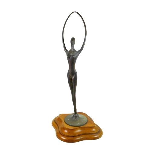 143 - An abstract bronzed female figurine of elongated form, raised upon a stepped mahogany base, unsigned... 