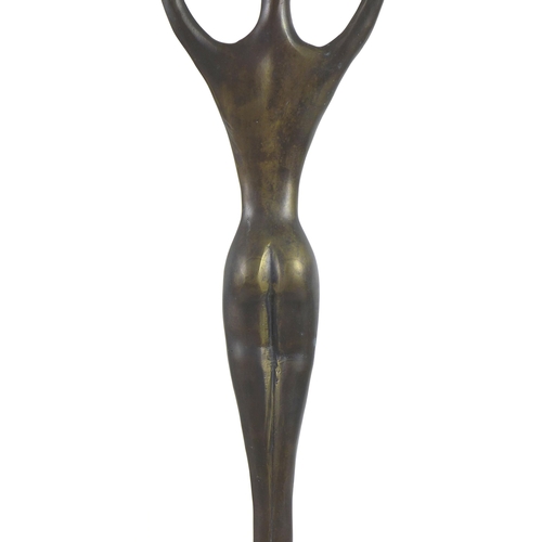 143 - An abstract bronzed female figurine of elongated form, raised upon a stepped mahogany base, unsigned... 