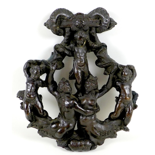 145 - A Victorian cast metal plaque, of oval outline with ram's horns to the top, depicting five figures a... 