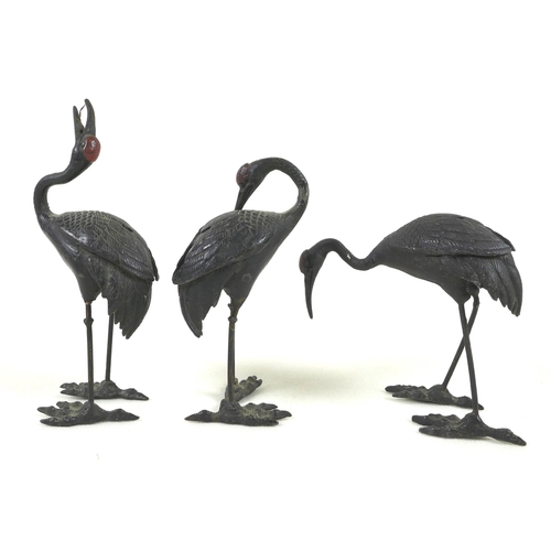 147 - A group of three cast metal sculptures, early 20th century, possibly Chinese, each modelled as a cra... 