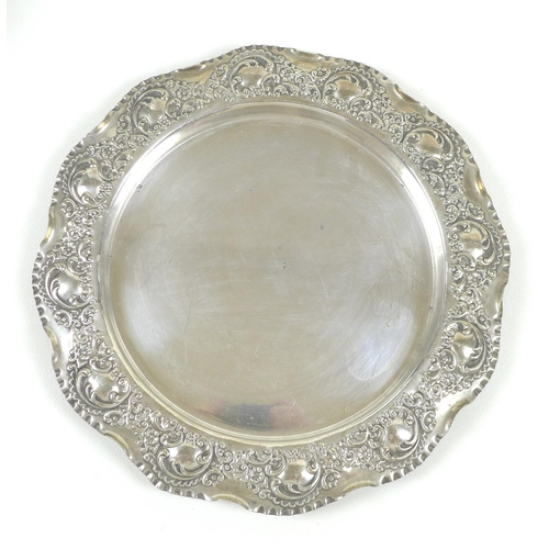 152 - A group of silver plated items, including two pairs of candlesticks, wine coasters, three trays, tod... 