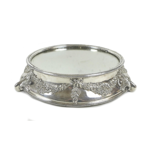 156 - A mid 20th century silver plated wedding cake stand, of circular form, with mirrored centre surround... 