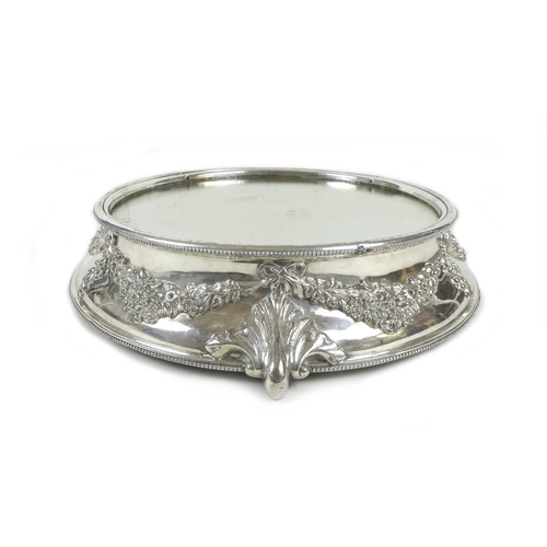 156 - A mid 20th century silver plated wedding cake stand, of circular form, with mirrored centre surround... 