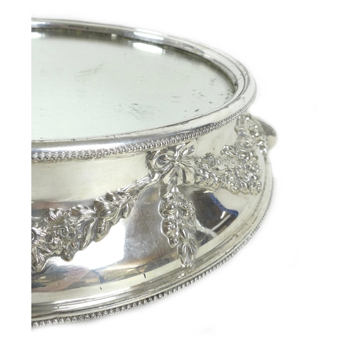 156 - A mid 20th century silver plated wedding cake stand, of circular form, with mirrored centre surround... 