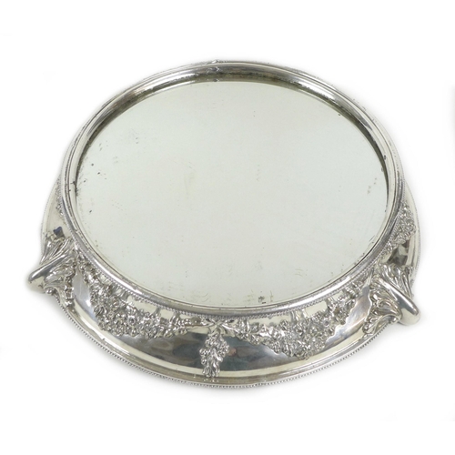 156 - A mid 20th century silver plated wedding cake stand, of circular form, with mirrored centre surround... 