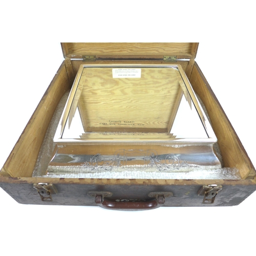 157 - An early 20th century silver plated wedding cake stand, of square form with bevelled mirror surface,... 