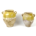 Two late 19th/early 20th century French glazed stoneware confit pots, both with lug handles largest ... 