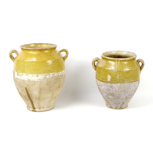 19 - Two late 19th/early 20th century French glazed stoneware confit pots, both with lug handles largest ... 