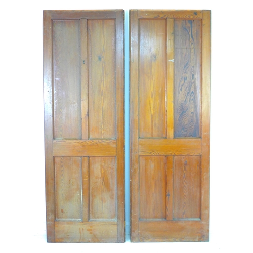 213 - A pair of four panelled stained pine doors, 71 by 4 by 202cm high.