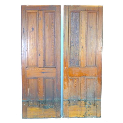 213 - A pair of four panelled stained pine doors, 71 by 4 by 202cm high.