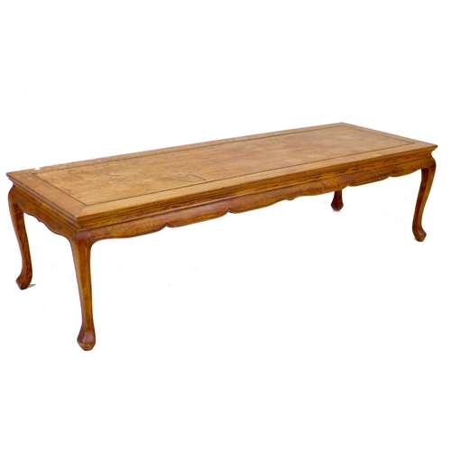 226 - A modern stained pine coffee table, raised on cabriole legs, 152.5 by 51.5 by 40.5cm high.