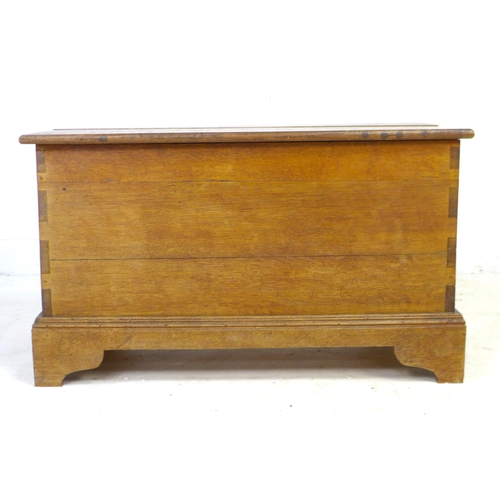 228 - A mid 20th century oak blanket chest, a/f top split, with lift lid, raised on bracket feet, 89 by 43... 