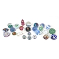 A collection of twenty-five 20th century glass paperweights, comprising a William Manson 