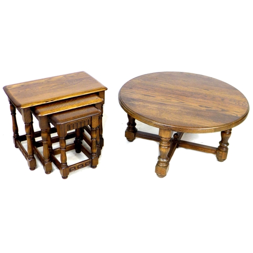 233 - A nest of three dark stained oak occasional tables, Old Charm style, 62 by 36.5 by 48cm high, togeth... 