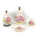 Four pieces of Moorcroft Pottery Magnolia pattern wares, including two table lamps, largest, 18 by 3... 