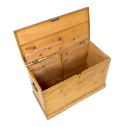 243 - A pitch pine blanket box, with metal handles and lift lid, 89.5 by 44.5 by 57.5cm high.