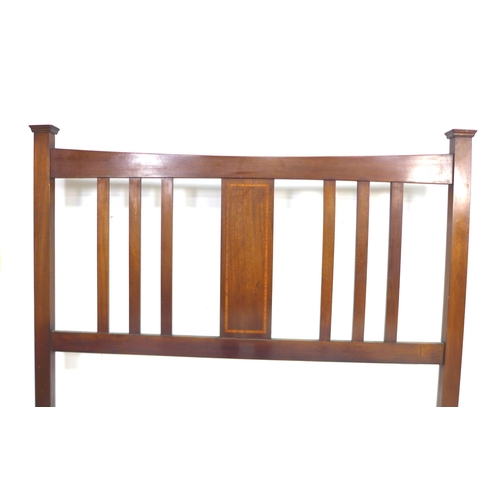 249 - An Edwardian mahogany double bed frame, with slatted head and tail boards, with inlay detail to cent... 