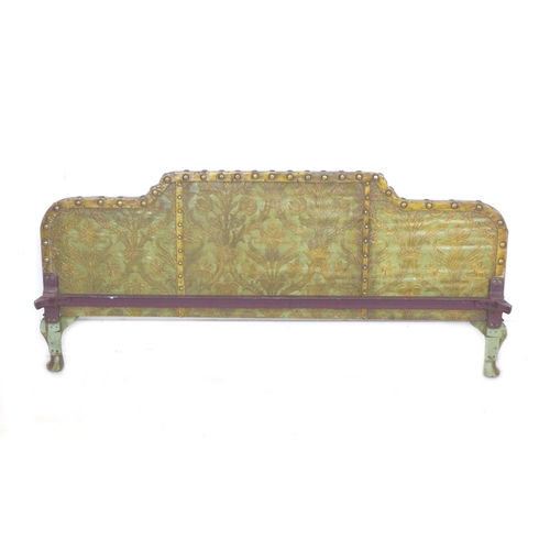 250 - A 20th century Continental bed head and footboard, with green and gilt leather effect work, brass st... 