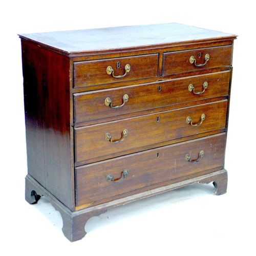 251 - A Georgian mahogany chest of drawers, two short over three long drawers, with brass swan neck handle... 