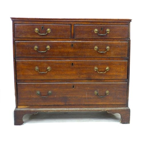 251 - A Georgian mahogany chest of drawers, two short over three long drawers, with brass swan neck handle... 