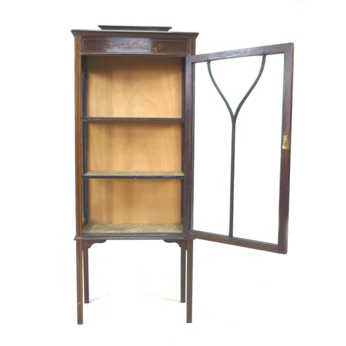 253 - An Edwardian mahogany display cabinet, with inlaid decoration, single leaded glazed door enclosing t... 