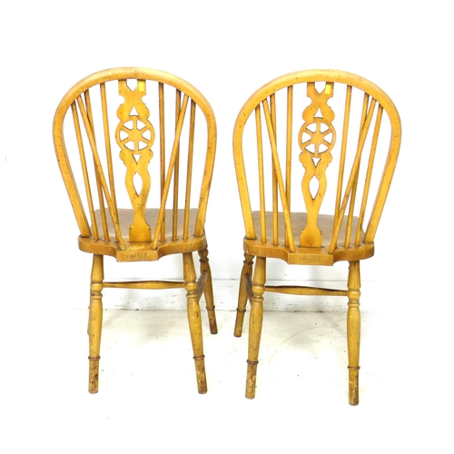 255 - A group of chairs, comprising a 19th century beech spindle back open armchair, a modern stained beec... 