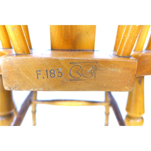 255 - A group of chairs, comprising a 19th century beech spindle back open armchair, a modern stained beec... 