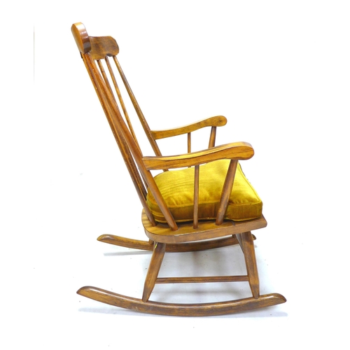 255 - A group of chairs, comprising a 19th century beech spindle back open armchair, a modern stained beec... 