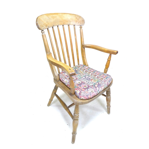 255 - A group of chairs, comprising a 19th century beech spindle back open armchair, a modern stained beec... 